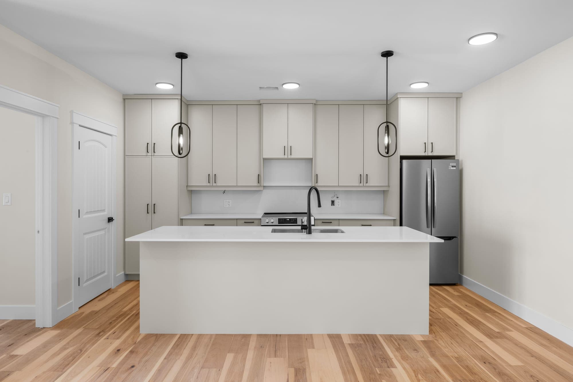 Custom-designed kitchen with quartz countertops and stainless appliances at 522 Capital Drive