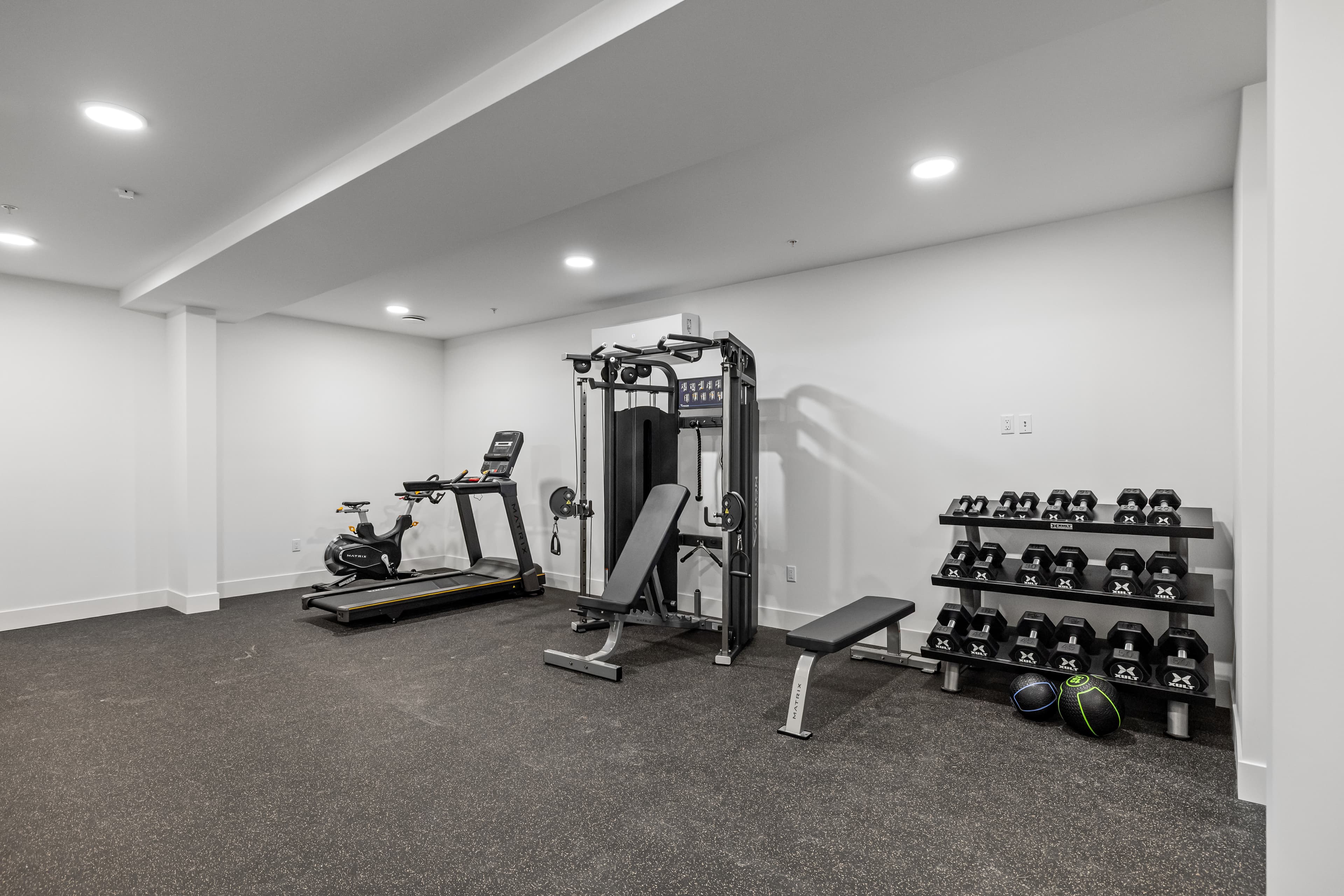 On-site 24/7 fitness studio with cardio and strength equipment